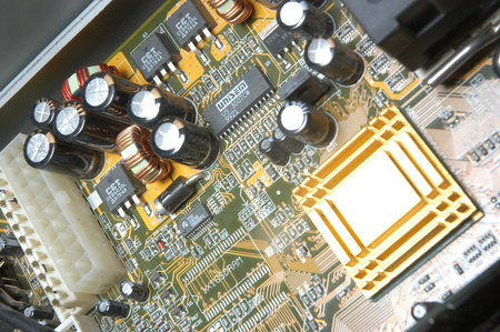 Close up of electronic circuit board with microchips and connectors.
