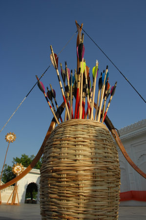 Arrows and arrows in a wicker basket against the blue skyの写真素材