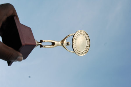 Close-up of a lamp with blue sky in the background.の写真素材