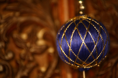 Blue Christmas ball on a wooden background. Close-up photo.の写真素材