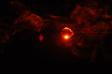 Red smoke on a black background. Abstract background with red smoke and fireの写真素材