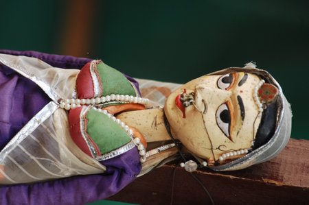 Handmade clay doll in a market, closeup of photo.の写真素材