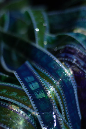Detail of a film strip with water droplets on it.の写真素材