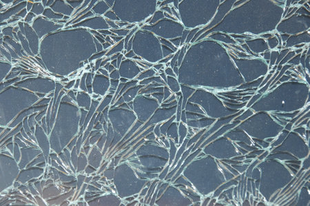 Broken glass on the car as a background. Close-up