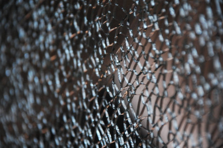Broken glass on a black background. Close-up photo.