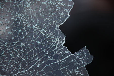 broken glass on a black background. close-up of broken glass