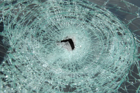 Broken glass on a car, close-up of photo.の写真素材