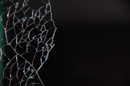 broken glass on a black background. close-up of broken glass