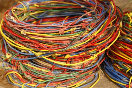 Colorful electrical wires in a pile, closeup of photo.