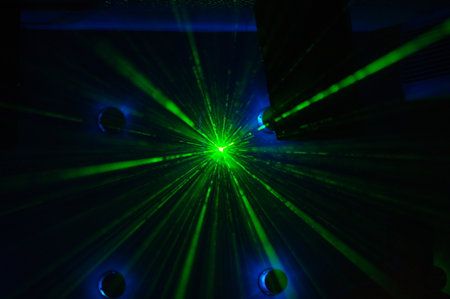 abstract scene of laser show in the dark room with green light