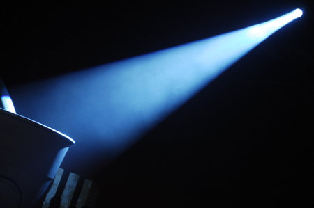 Spotlight on stage, close-up, blue light from spotlightsの写真素材