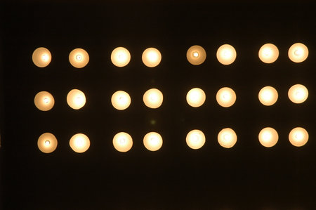 Candles on the ceiling in the dark, closeup of photo