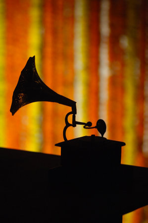 Old gramophone on a dark background. Silhouette of a gramophone.の写真素材