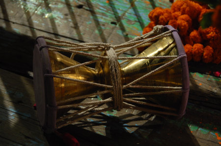 Mardi Gras drum with marigold flowers in the backgroundの写真素材