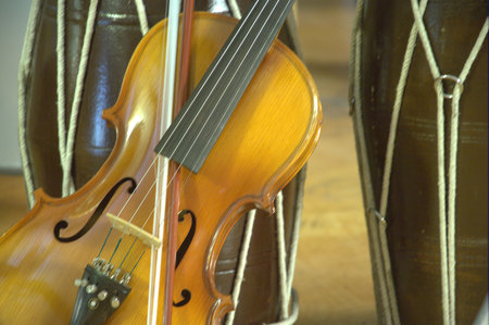 violin and bow on a wooden background. close-up.の写真素材