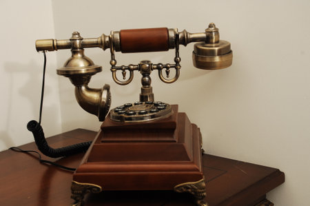 Vintage telephone on a wooden table. Retro telephone. Old telephone.の写真素材