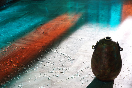 Water drops on the surface of the water and a clay pot.の写真素材