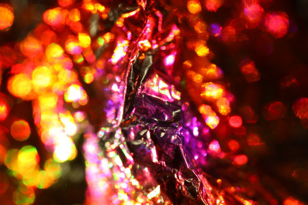 abstract background of colored crumpled foil close-up macroの写真素材