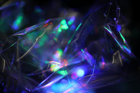 Macro shot of a colorful holographic crystal on black background.