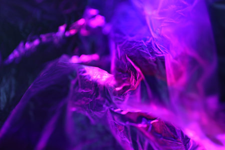 Purple crumpled paper as abstract background. Close up.