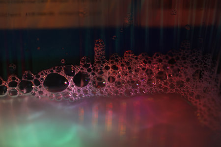 Close up of soap bubbles in the water. Shallow DOFの写真素材