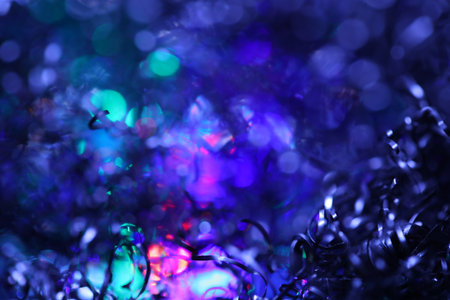 abstract background with bokeh defocused lights and tinselの写真素材