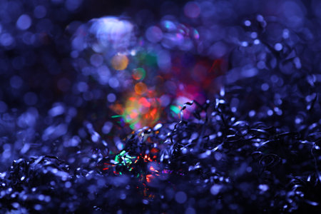 abstract background with bokeh defocused lights and tinsel
