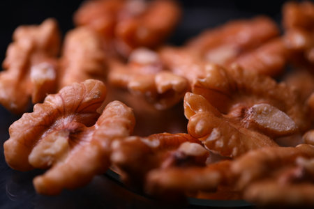 peeled walnuts on a dark background close-up. macro
