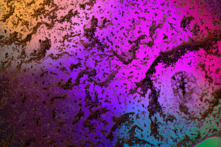 Colorful abstract background with spots of paint on the surface of the water
