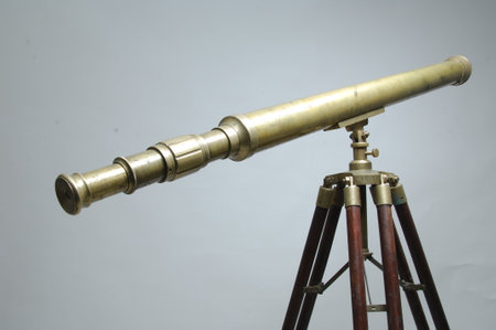 Telescope on a tripod isolated on a white background, close-up