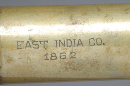 Old brass bullet casings on a white background, closeup of photo