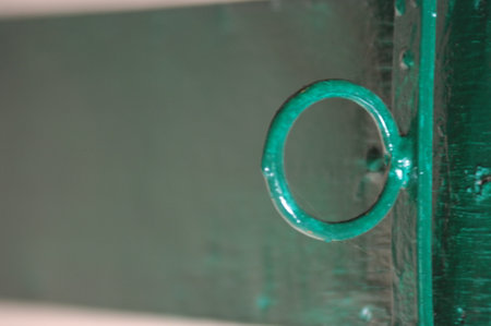 Close up view of a green door with a ring on it.の写真素材