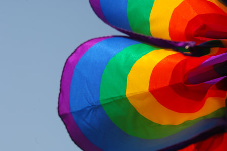 Rainbow kite on a blue sky background, close-upの写真素材