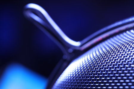 Close-up of a speaker. Shallow depth of field.