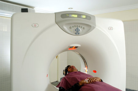Patient at the computed tomography (CT) scanner in hospital.