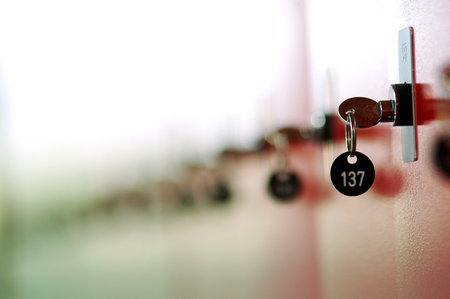 Close-up of keys on lockers in a locker room.の写真素材