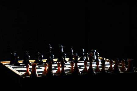 Chess board with figures on a dark background. Selective focus.の写真素材