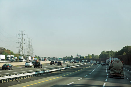 highway with cars on the road in the city in the summerの写真素材