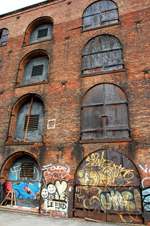 Old factory building with graffiti on the walls. Street art concept.の写真素材