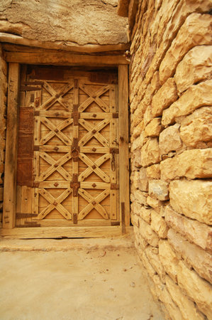 Old wooden door in the ancient city of Petra, Jordan. Petra is one of the New Seven Wonders of the World.の写真素材
