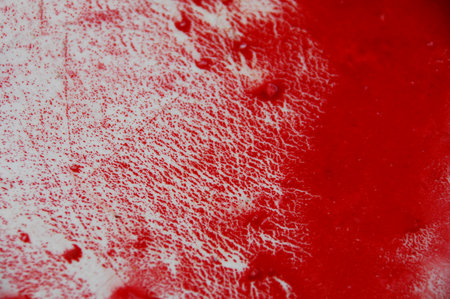 Blood stains on a white background, close-up, macro.の写真素材
