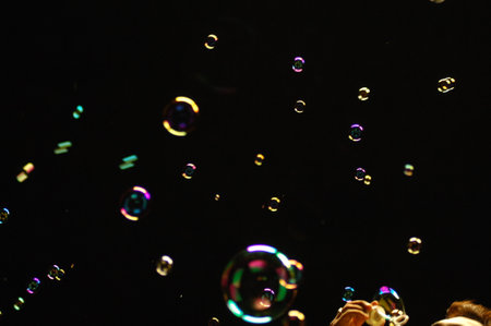 Soap bubbles on a black background. Shallow depth of field.
