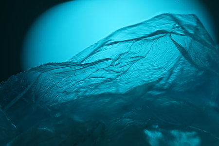 Plastic bag on dark blue background. Close-up view.の写真素材
