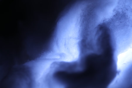 abstract background of blue smoke in the dark, closeup of photoの写真素材