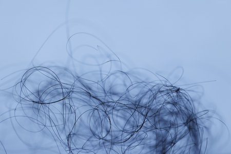 closeup of hair on white background in blue toning. macroの写真素材