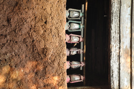A row of lanterns on the wall of an old house.の写真素材