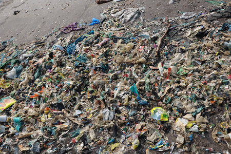 Pile of garbage on the beach. Pollution of environment concept