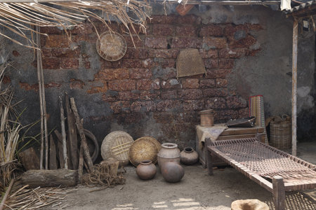 old clay pots and other utensils on the background of a brick wallの写真素材