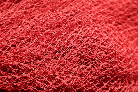 Close up of red fishing net texture. Abstract background and texture for design.の写真素材