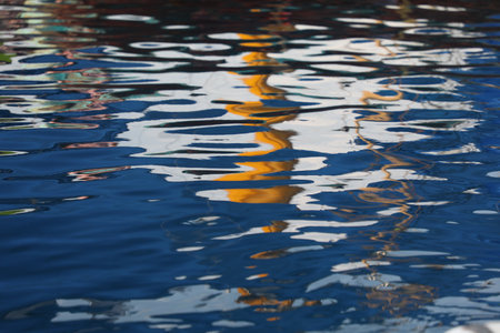 Reflection of a boat in the water of a canal in Veniceの写真素材